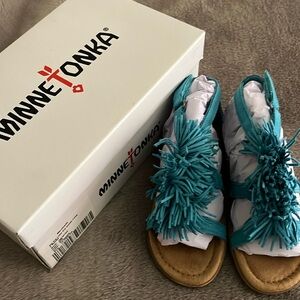 New in box , turquoise Minnetonka, girls sandals. Never worn!